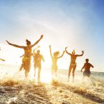 Crowd people friends sunset beach holidays